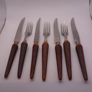 Three(3) Faux Bone Handle Forks and Four(4) Faux Bone Handle Steak Knives